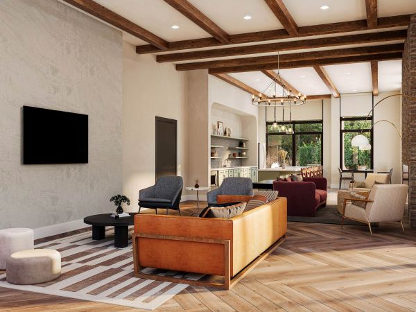 Modern clubhouse lounge at Linden Village featuring wood-beam ceilings, cozy seating areas, and natural light-filled interiors.