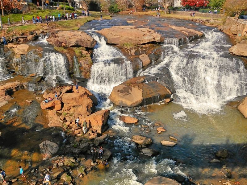 Scenic waterfall view at a nearby Charlotte park, offering peaceful natural surroundings just a short drive from Linden Village.