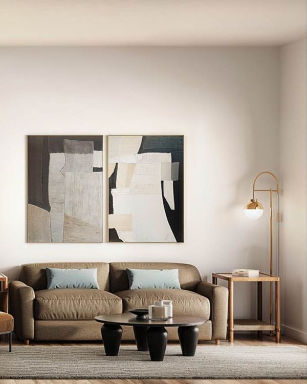 Bright kitchen and living area at Linden Village featuring modern cabinetry, stone countertops, and warm wood-style flooring.