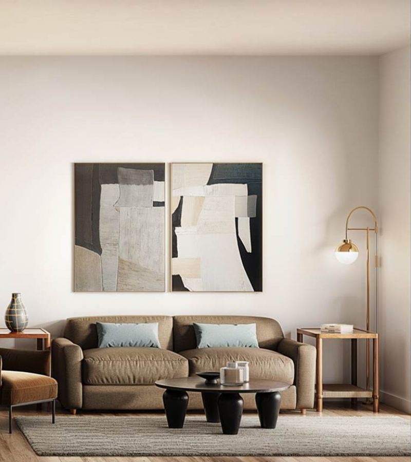 Bright kitchen and living area at Linden Village featuring modern cabinetry, stone countertops, and warm wood-style flooring.