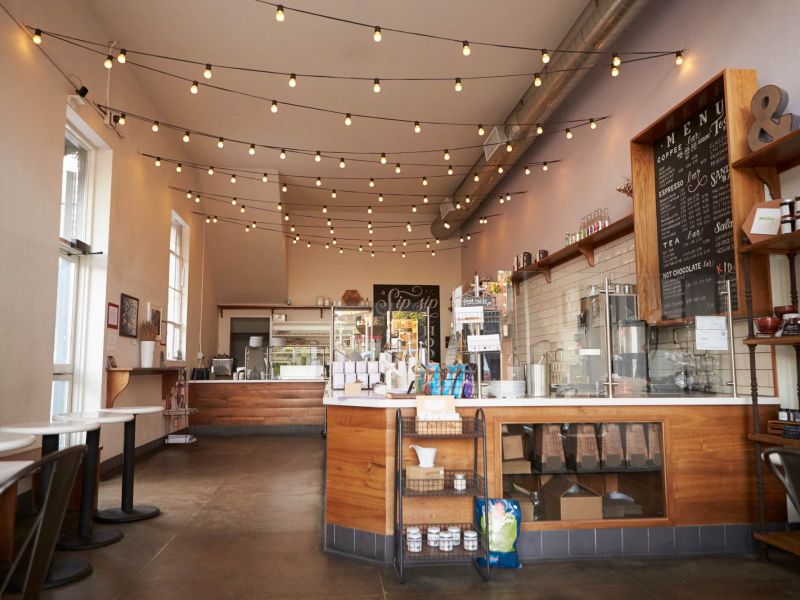 Cozy local café near Linden Village featuring warm lighting, wooden accents, and a relaxed atmosphere.